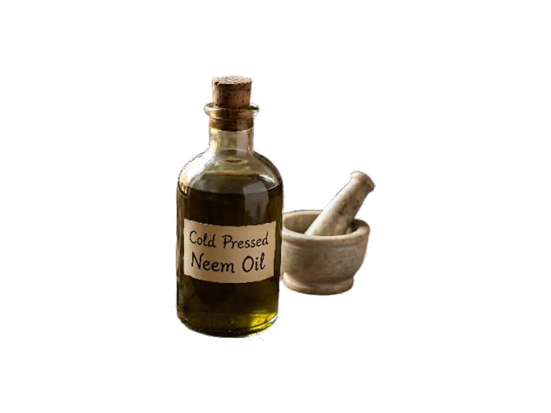 A bottle of cold pressed neem oil beside a mortar and pestle